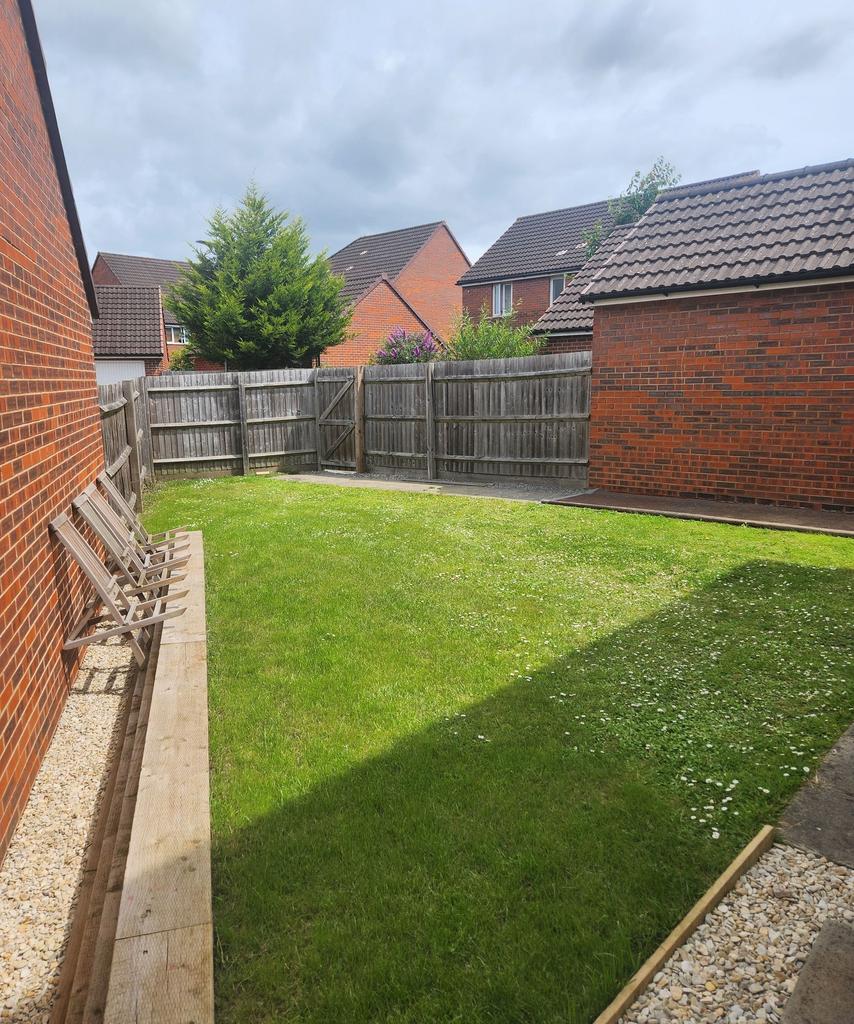 Well-kept private rear garden with a neat lawn,...