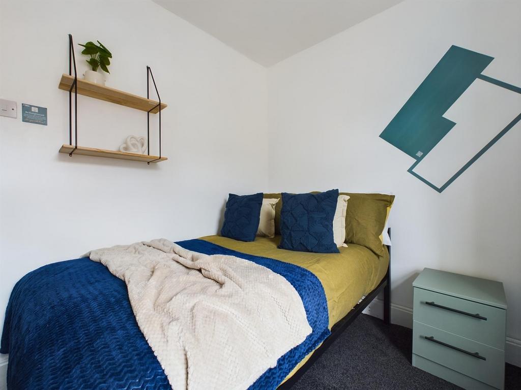 A stylish and inviting double bedroom with mode...