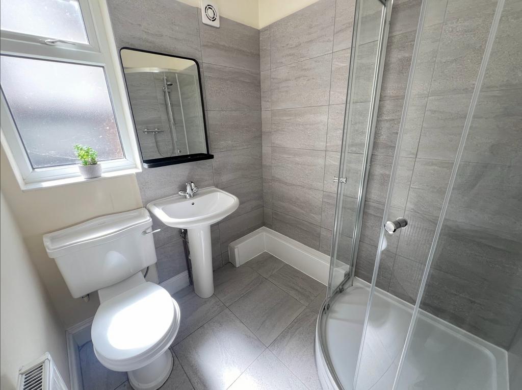 A modern and clean bathroom featuring a stylish...