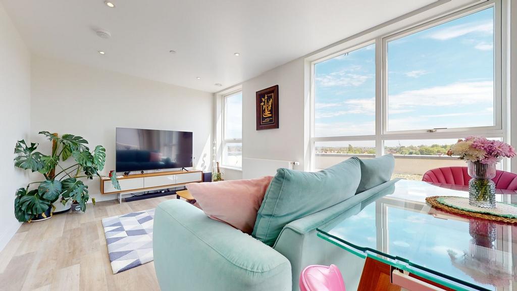 Bright contemporary living room with large wind...