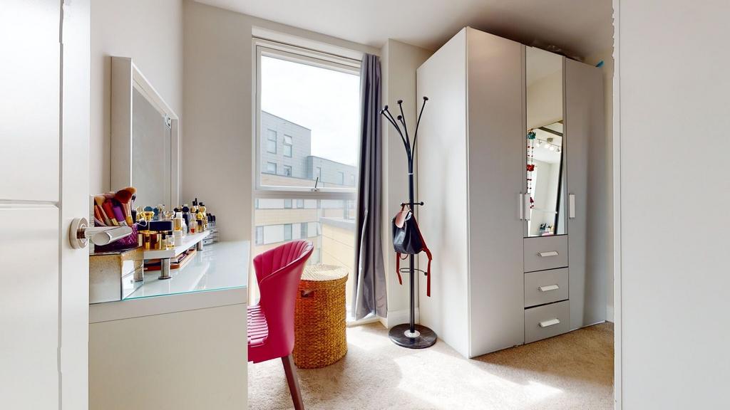 Bright, modern bedroom corner with a vanity by ...