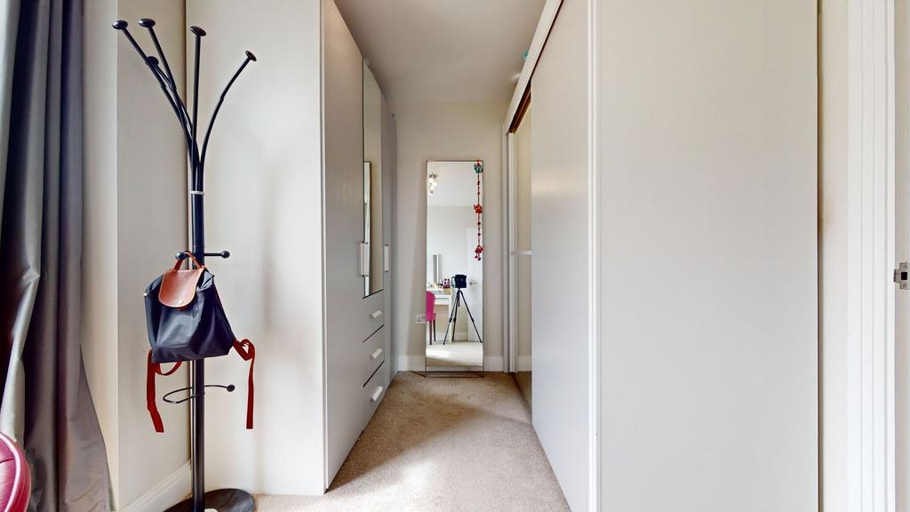 Bright, well-maintained passage with built-in s...