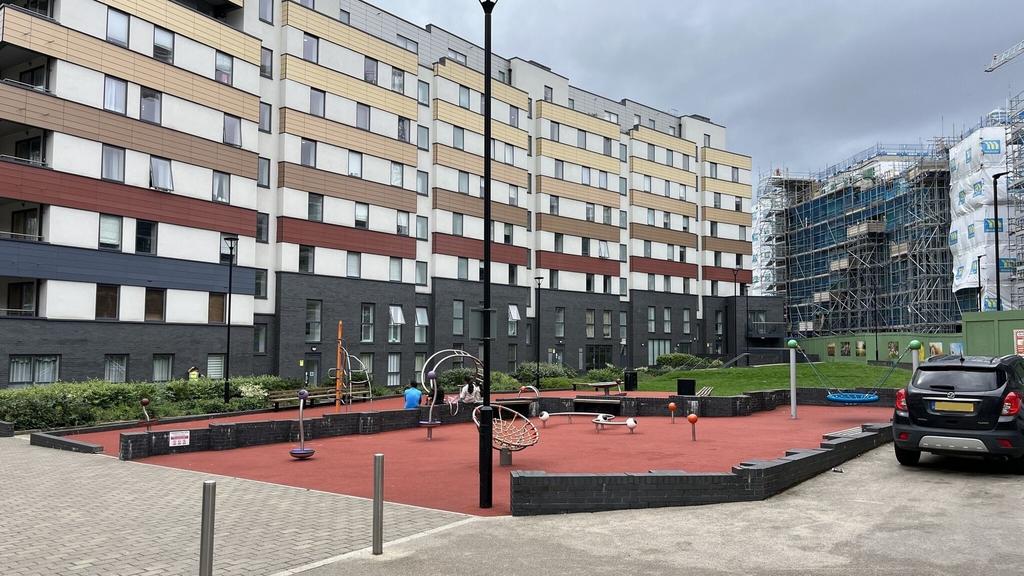 Modern apartment building with colourful horizo...