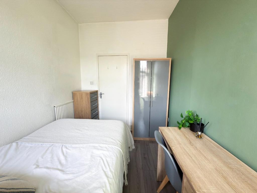 Bright, neatly presented bedroom with a double ...