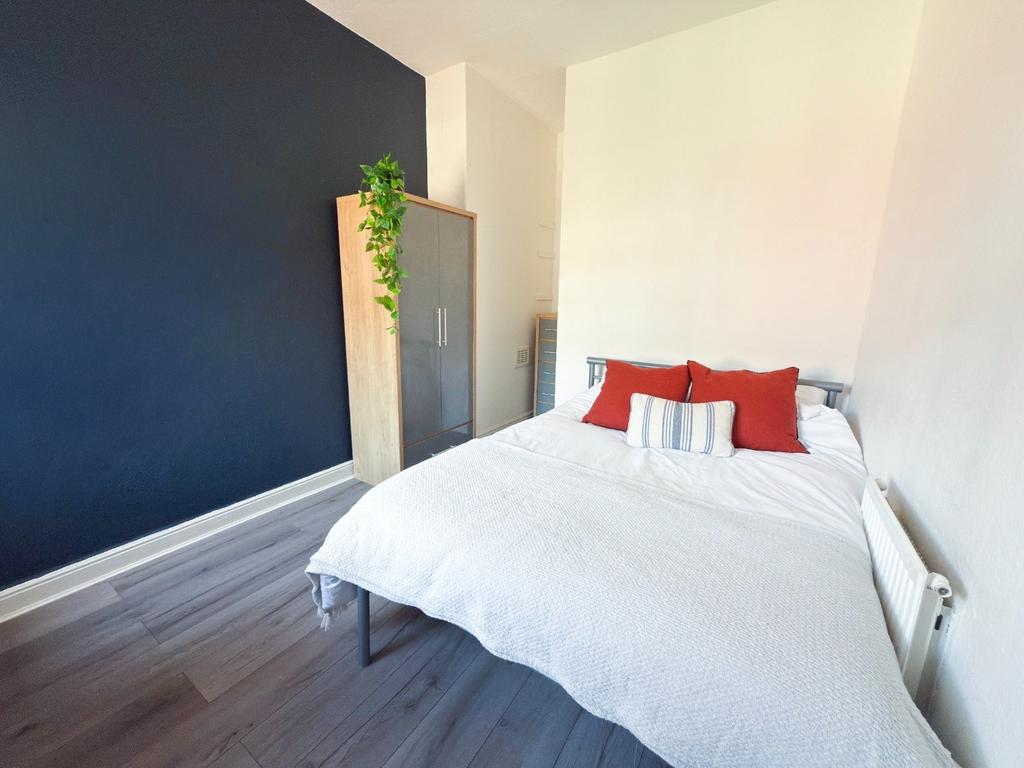 Bright, modern bedroom with a comfortable doubl...