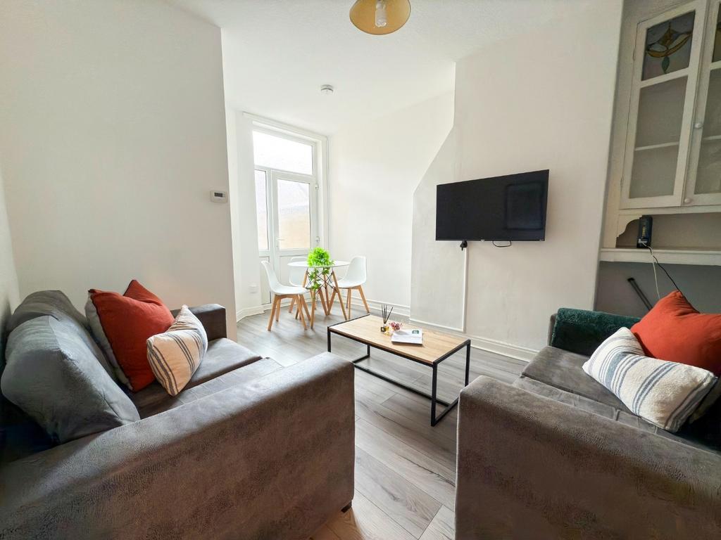 Bright, modern living room with two comfy sofas...