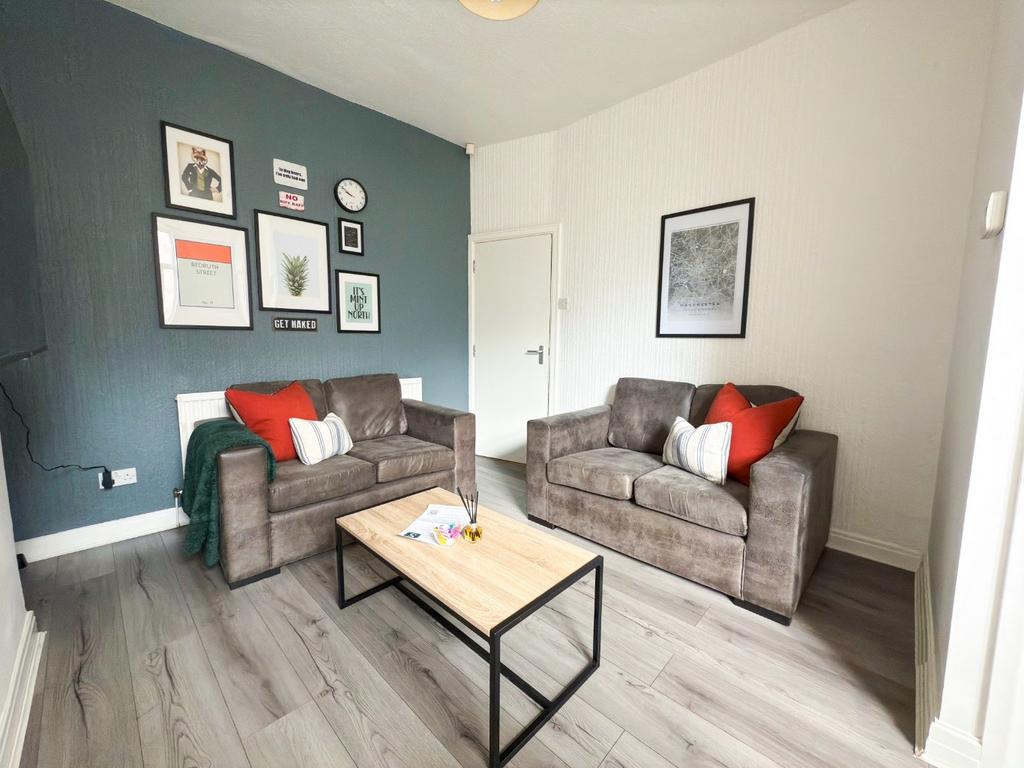 Bright, modern living room with two comfortable...