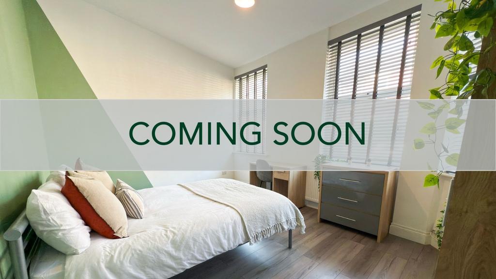 Bright, modern double bedroom with a comfortabl...