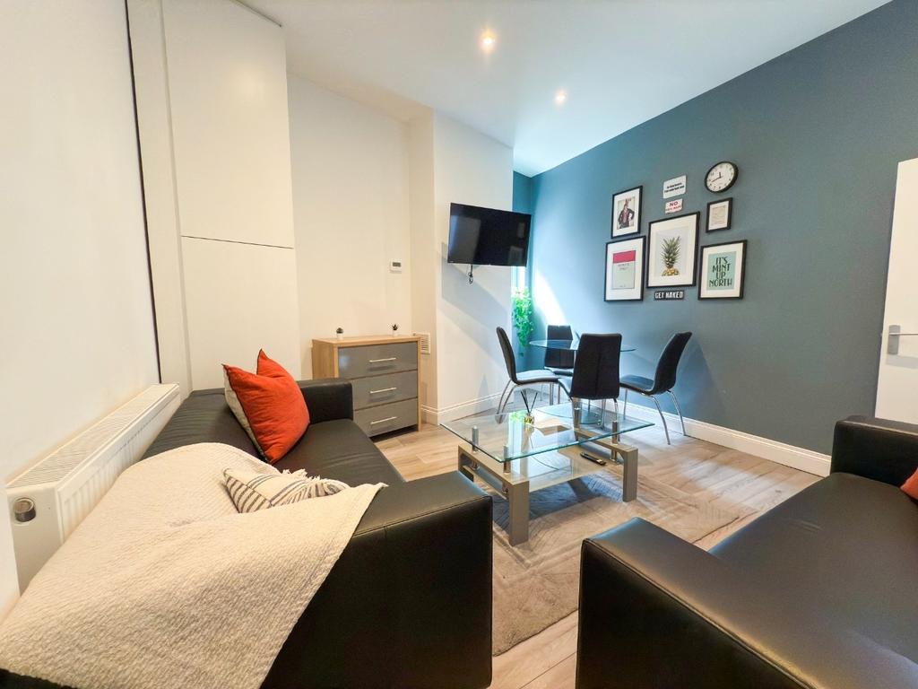 Bright, modern living room with comfortable bla...