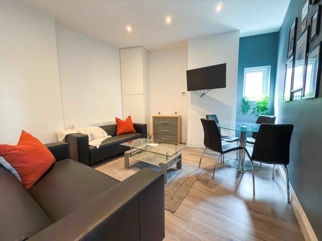 Bright, modern living room with comfortable sof...