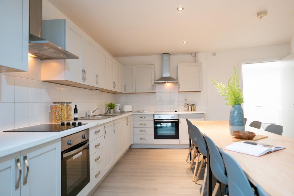 Modern kitchen featuring ample counter space, s...