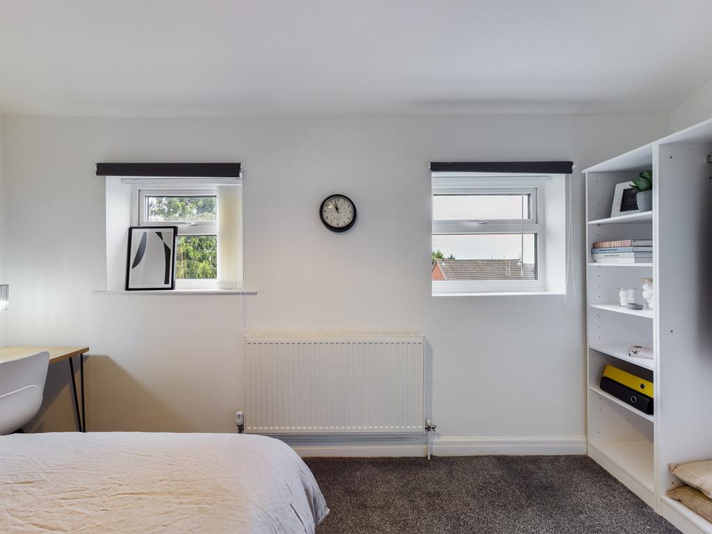 A bright and tidy double bedroom with ample nat...