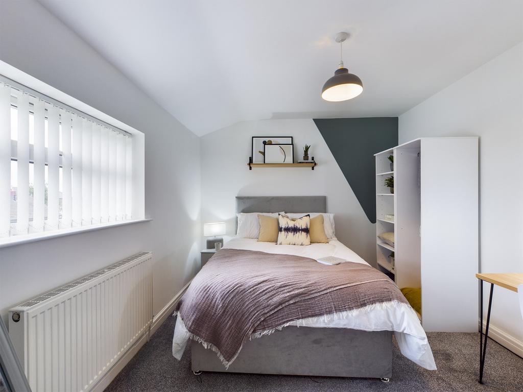 A stylish and inviting double bedroom featuring...