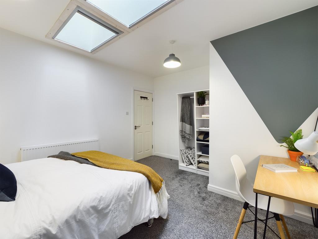 A stylish and spacious double bedroom featuring...