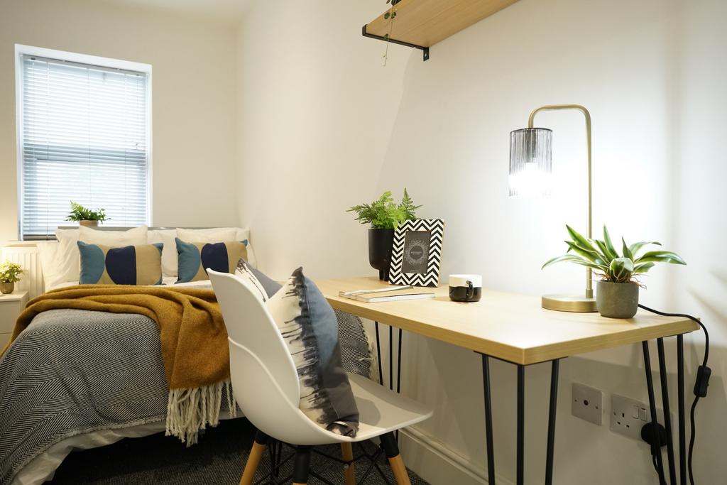 A bright and welcoming living room featuring na...