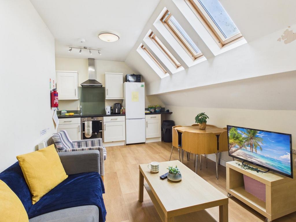 Bright open-plan living space with a compact fi...