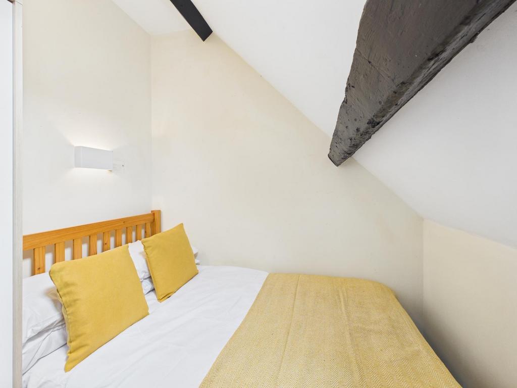 Bright, neatly presented attic bedroom with slo...