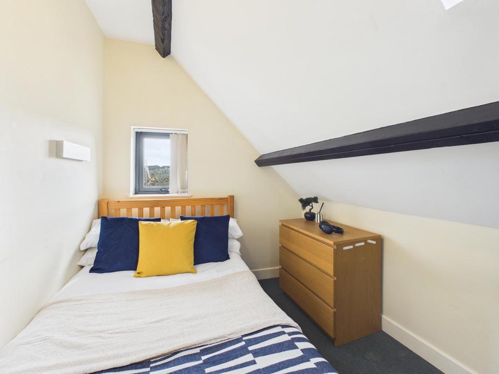 Bright, neatly presented attic bedroom with a c...