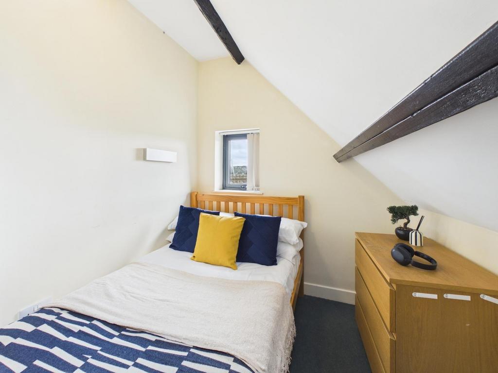 Bright, neatly presented attic-style single bed...