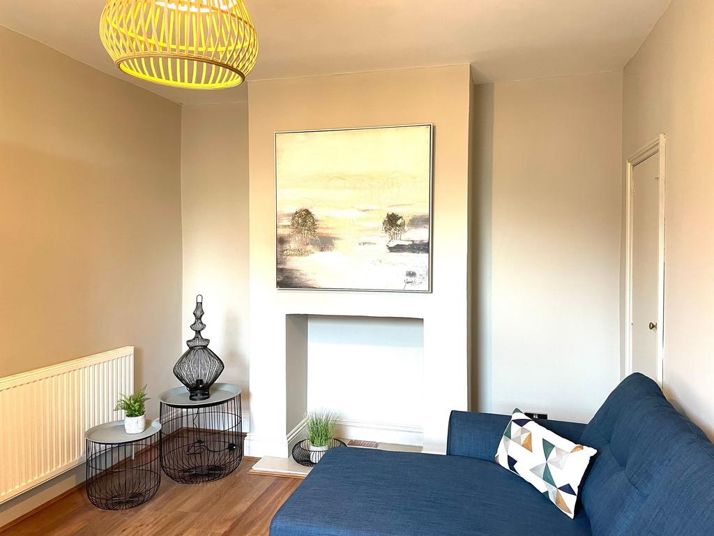 A bright and stylish living room featuring a mo...