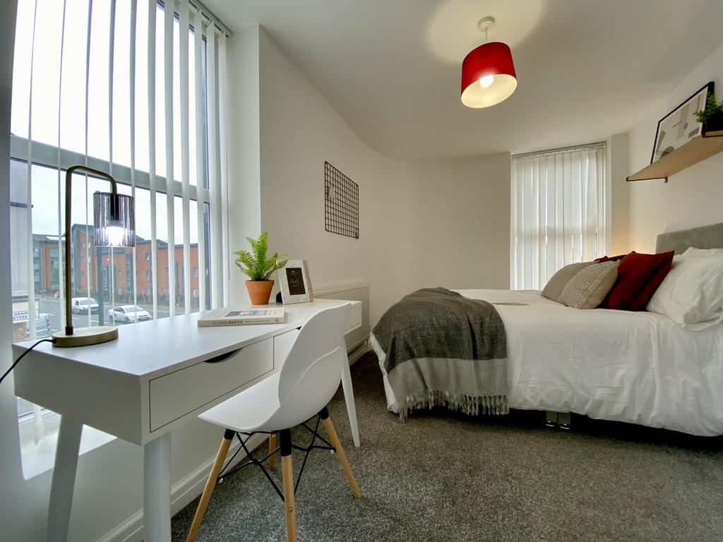 A spacious and inviting large double bedroom wi...
