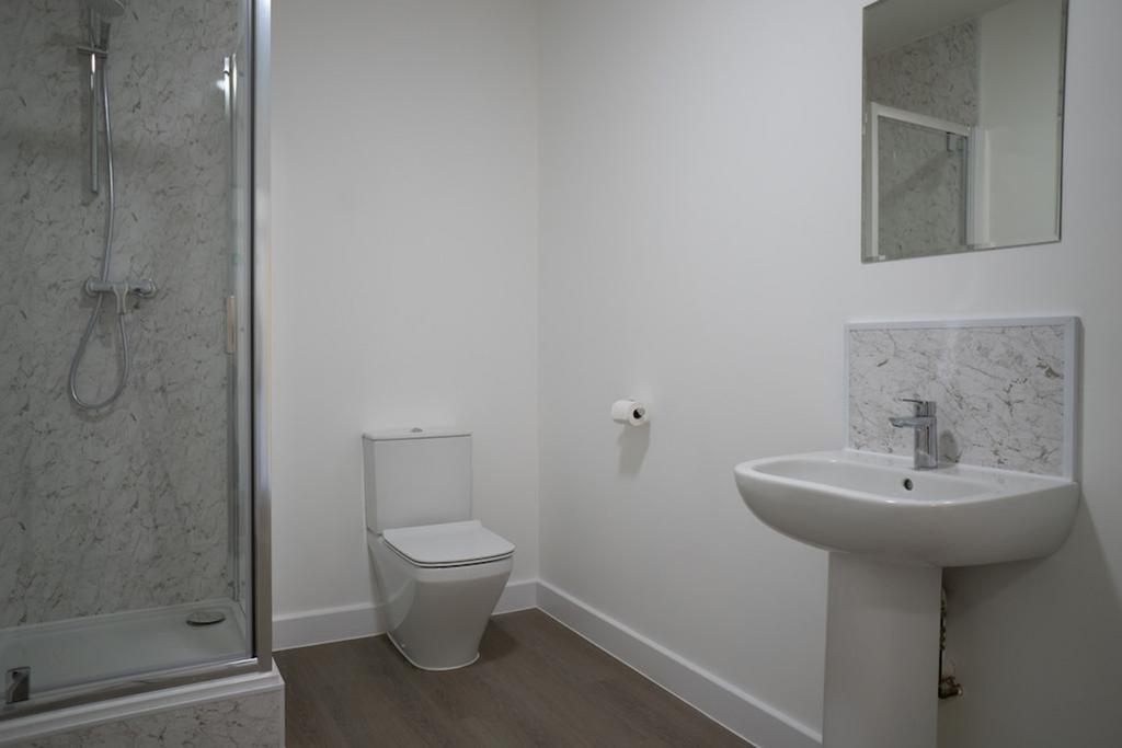 A bright and modern bathroom featuring a stylis...