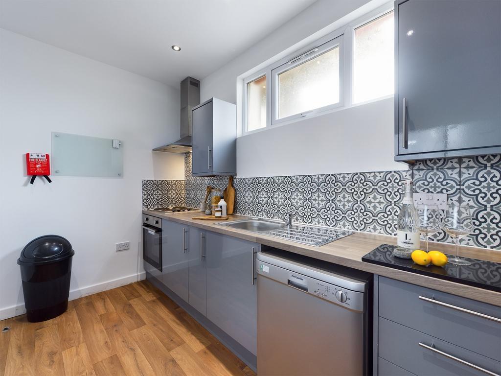 A modern and well-equipped kitchen featuring st...