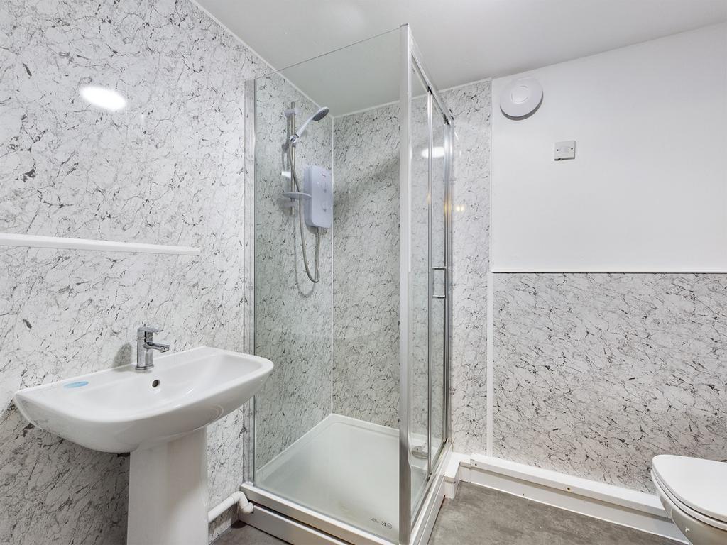 A clean and modern bathroom featuring a spaciou...