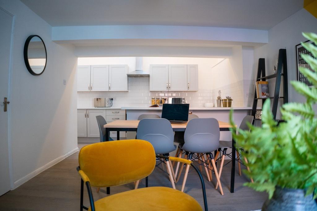 A spacious and well-lit modern living room feat...