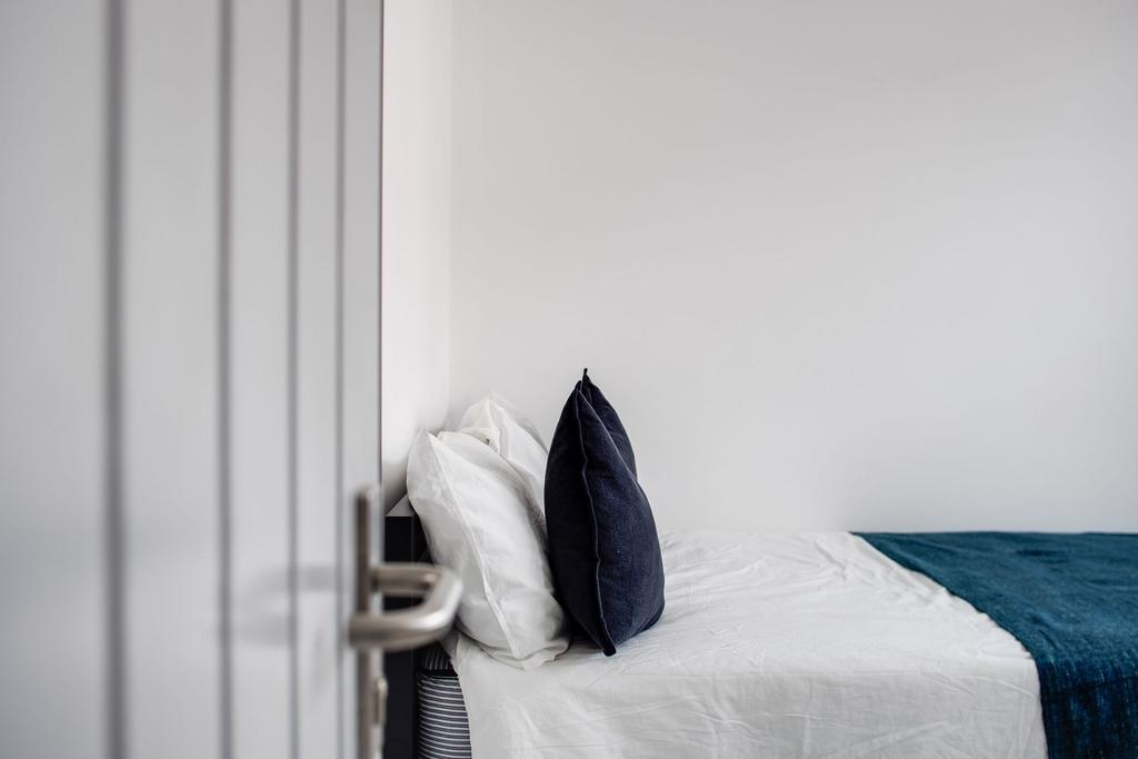 A cozy and well-maintained bedroom featuring a ...