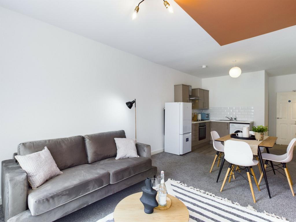 A spacious and inviting large modern living roo...