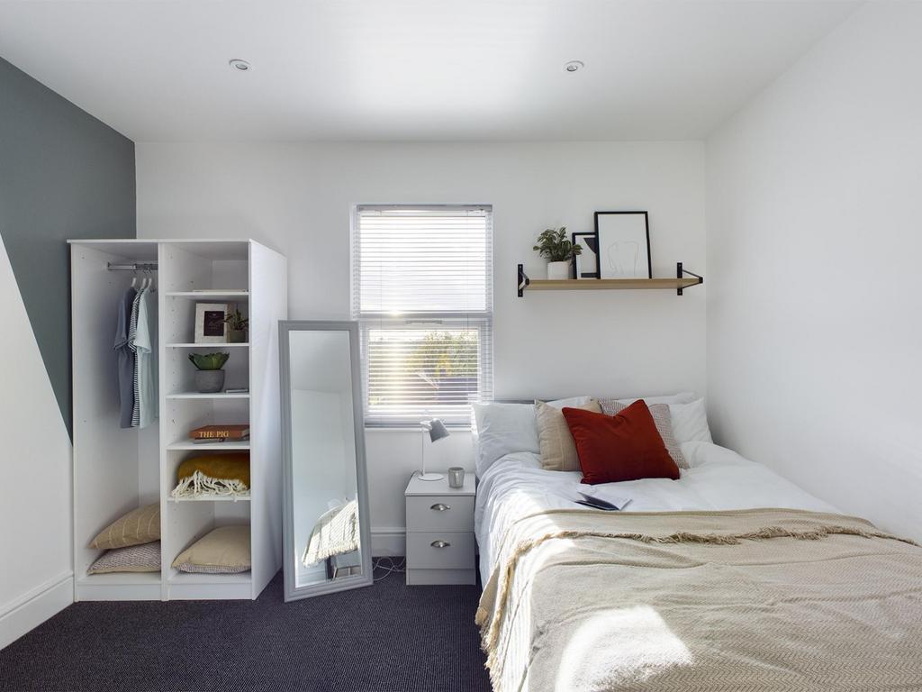Bright, tidy furnished bedroom with a comfortab...