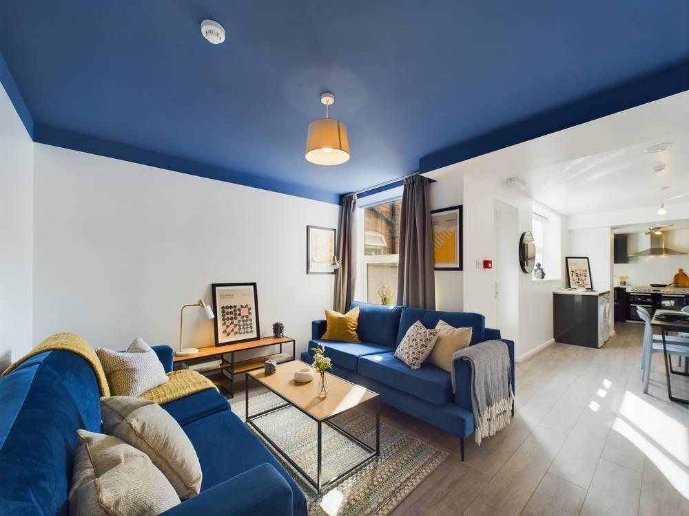 Bright, contemporary living room with coordinat...