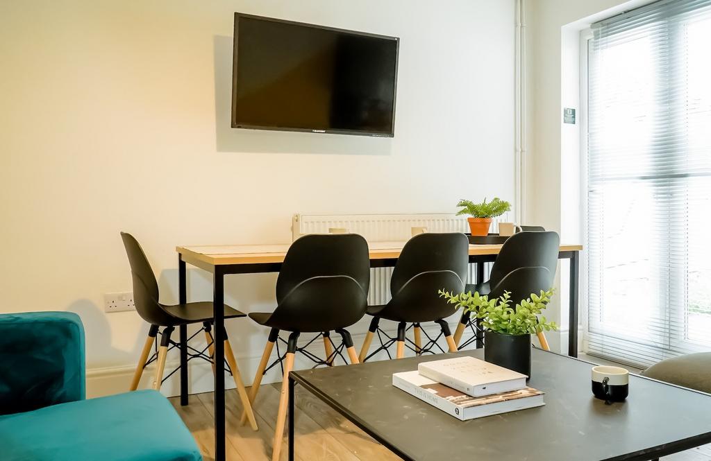 A modern, well-lit living room featuring comfor...