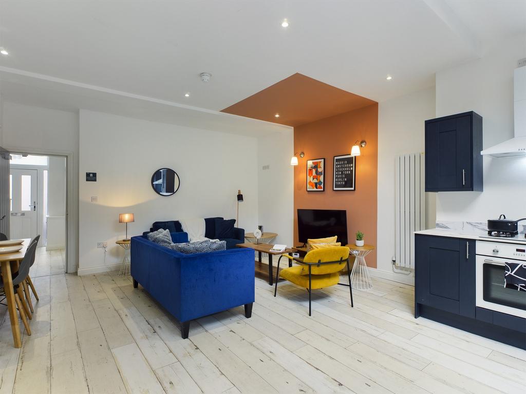 A stylish and spacious modern living room, feat...