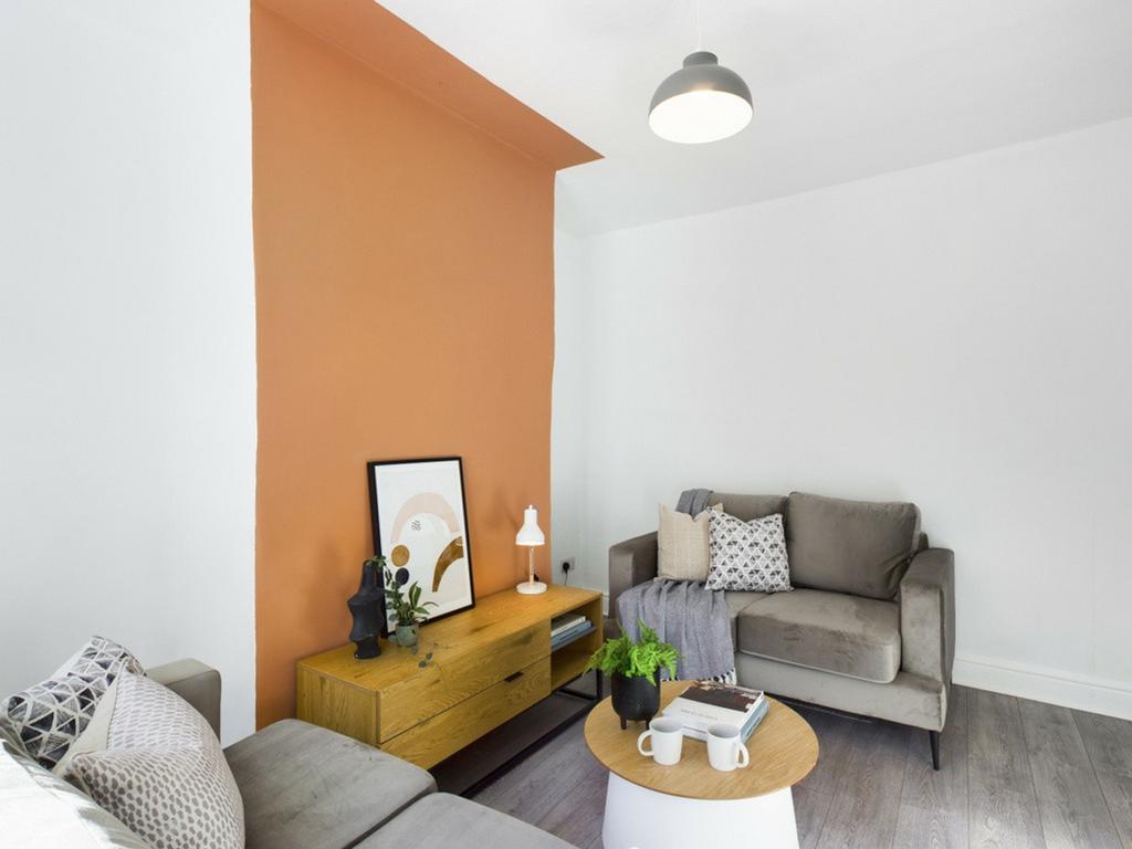 A bright and inviting living room with modern d...