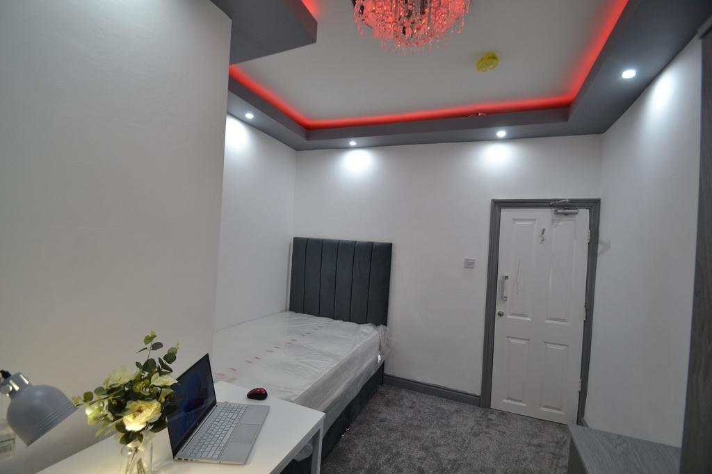 A modern bedroom featuring a comfortable bed wi...