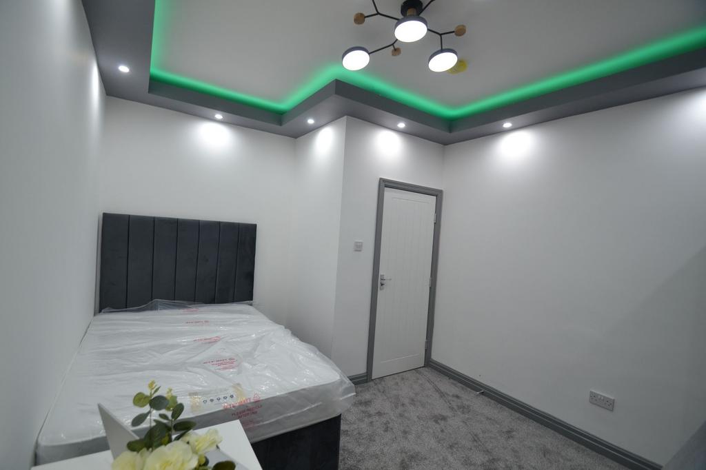 A tidy and modern small bathroom with a sleek d...