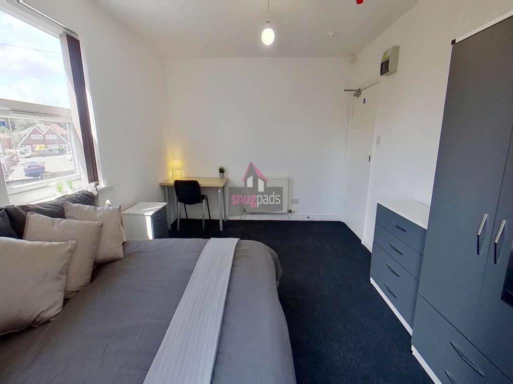 Bright, well-presented bedroom with a comfortab...