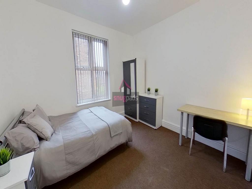 Bright, tidy bedroom with a comfortable bed, st...