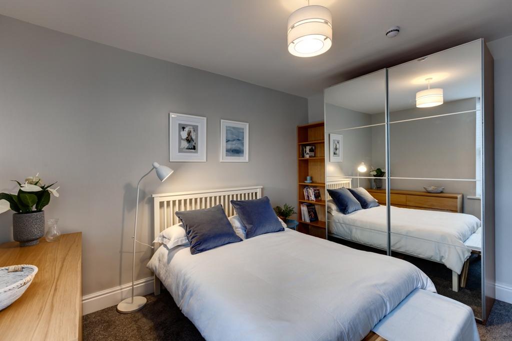 Bright, modern double bedroom with a comfortabl...