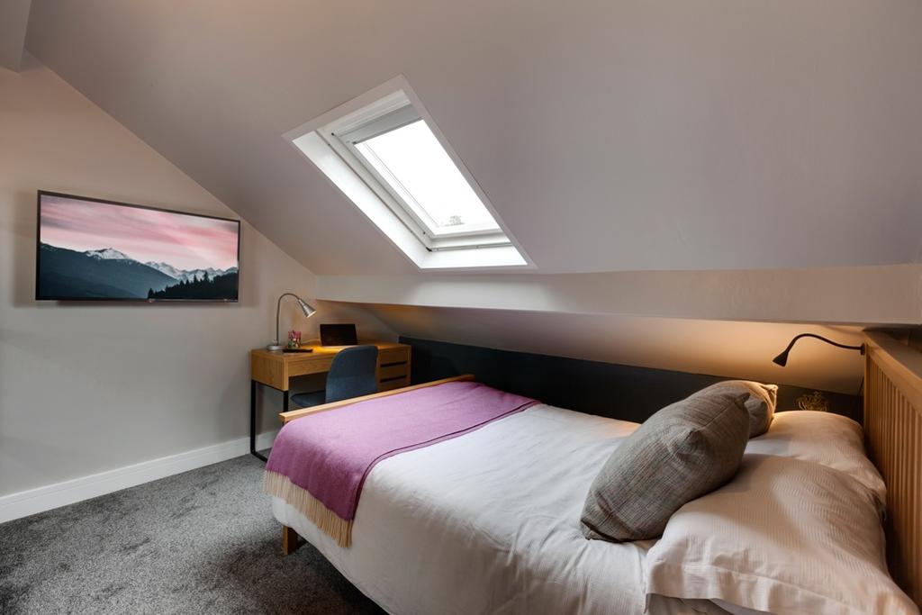 Bright attic double bedroom with a skylight, ne...