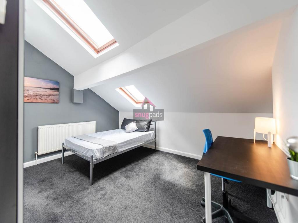 Bright double bedroom in a loft-style space wit...