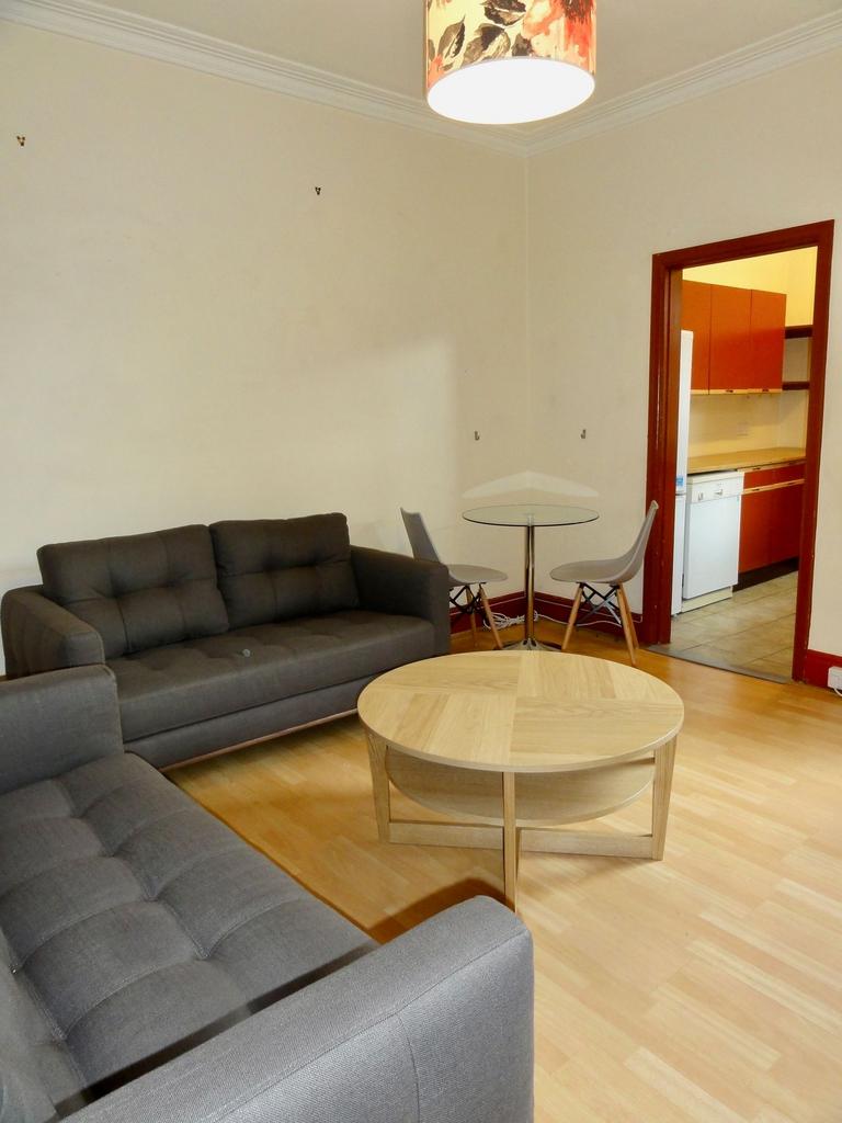 A cozy, well-maintained living room featuring c...