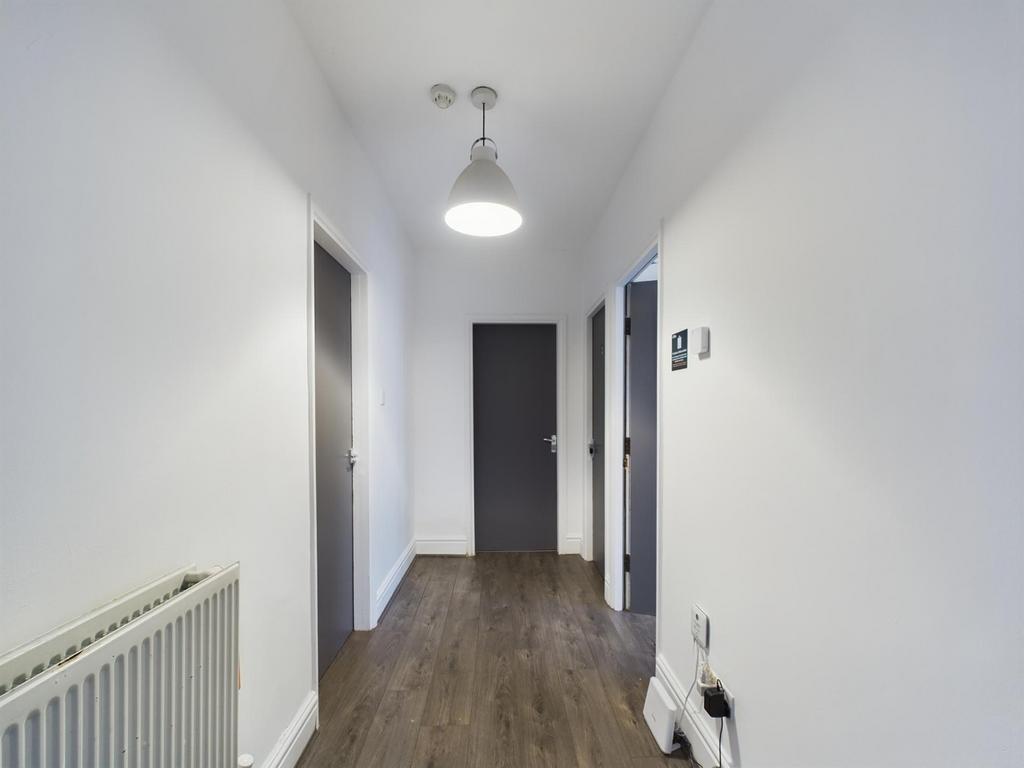 A bright and tidy hallway, providing a welcomin...