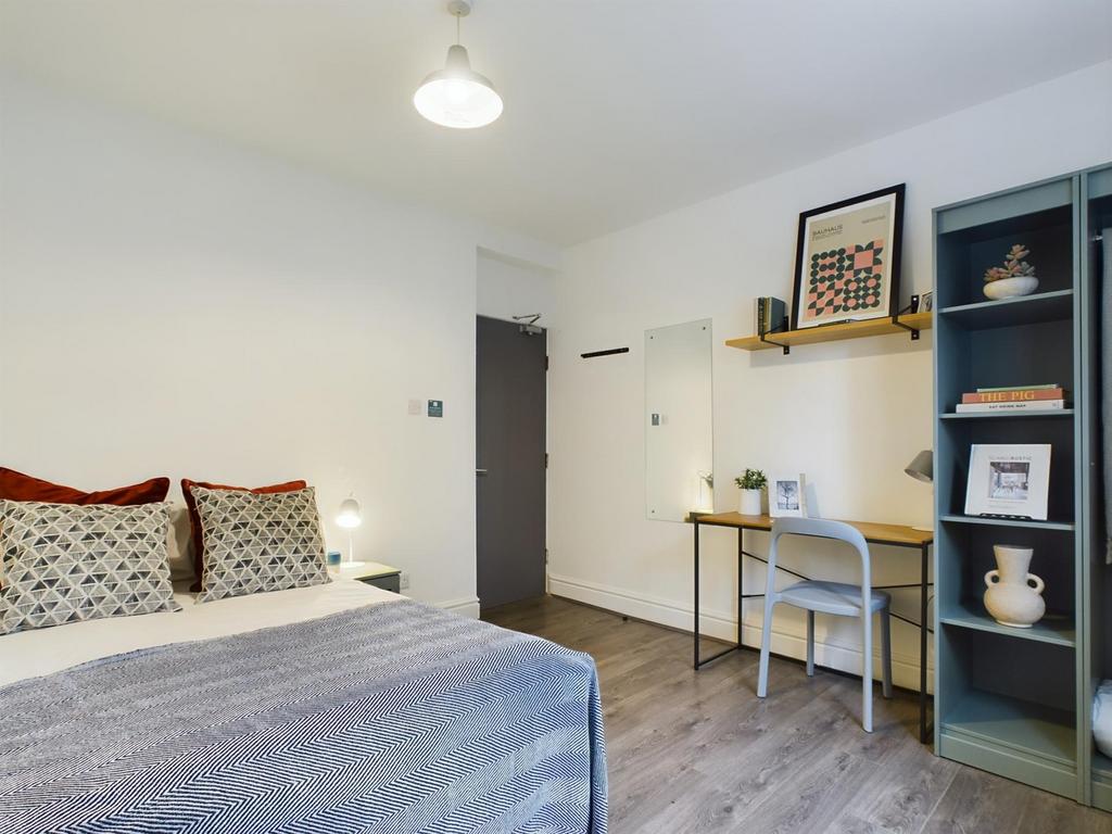 A stylish and inviting double bedroom featuring...