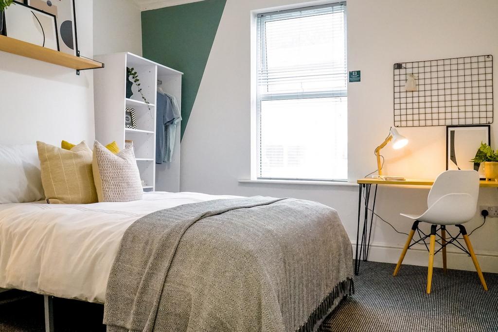 A stylish and inviting double bedroom featuring...