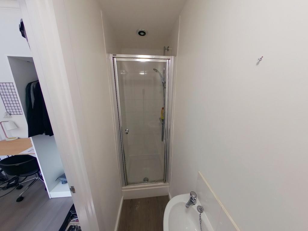 A tidy and functional bathroom featuring a mode...
