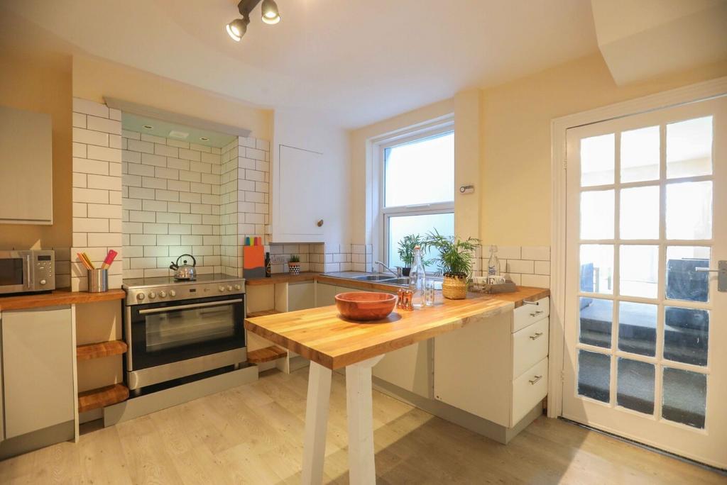 Bright and welcoming kitchen featuring natural ...