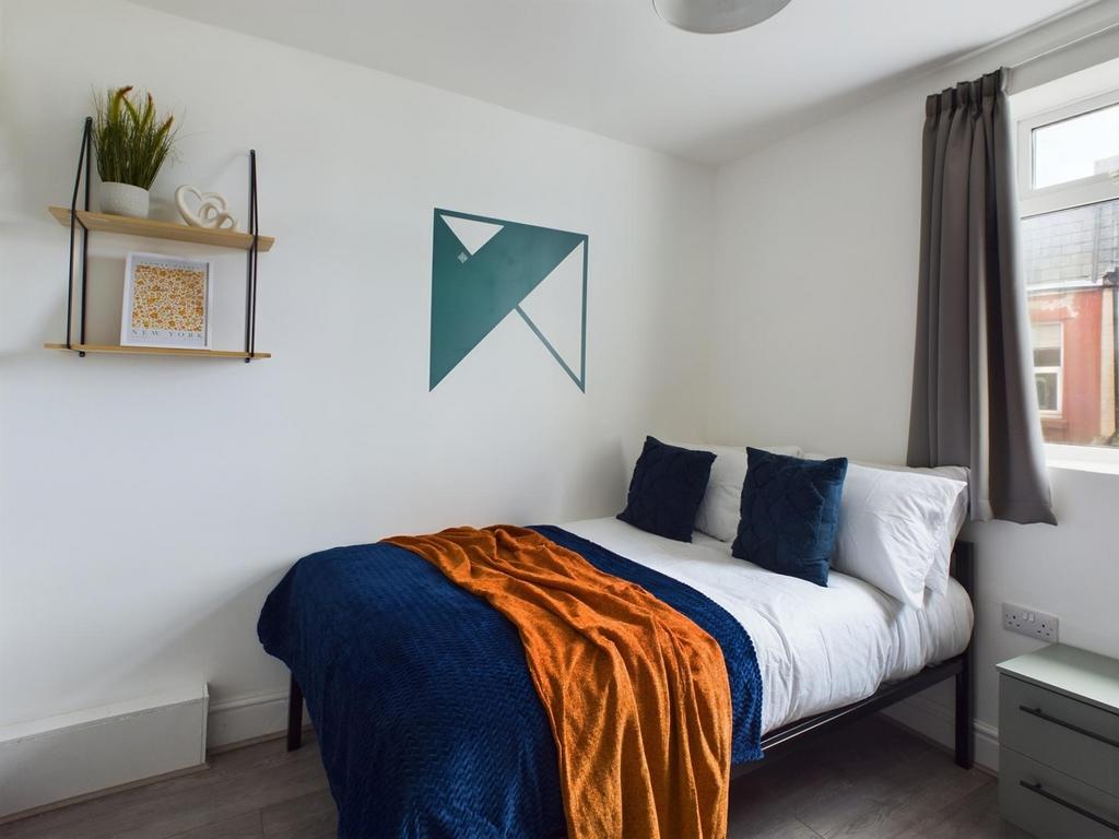 A stylish and inviting double bedroom featuring...